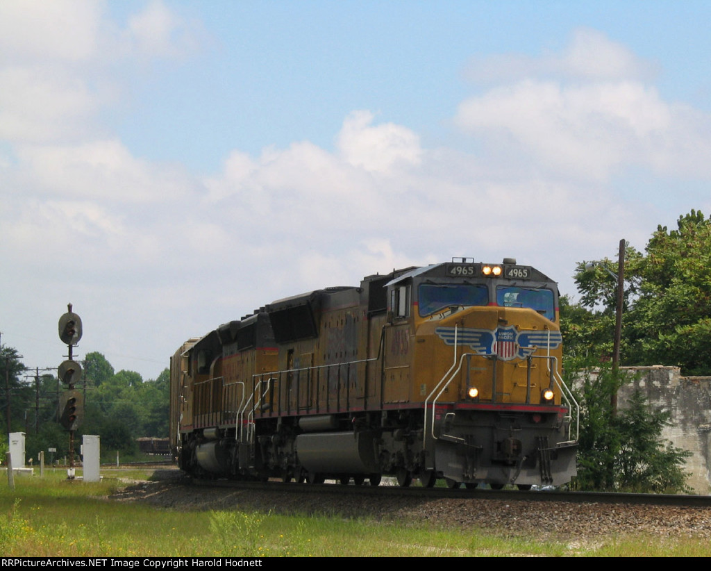 UP 4965 leads a train eastbound